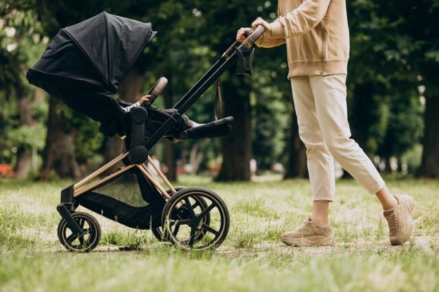 young-mother-walking-with-baby-carriage-park-2048x1365-1-640x426-1.jpg